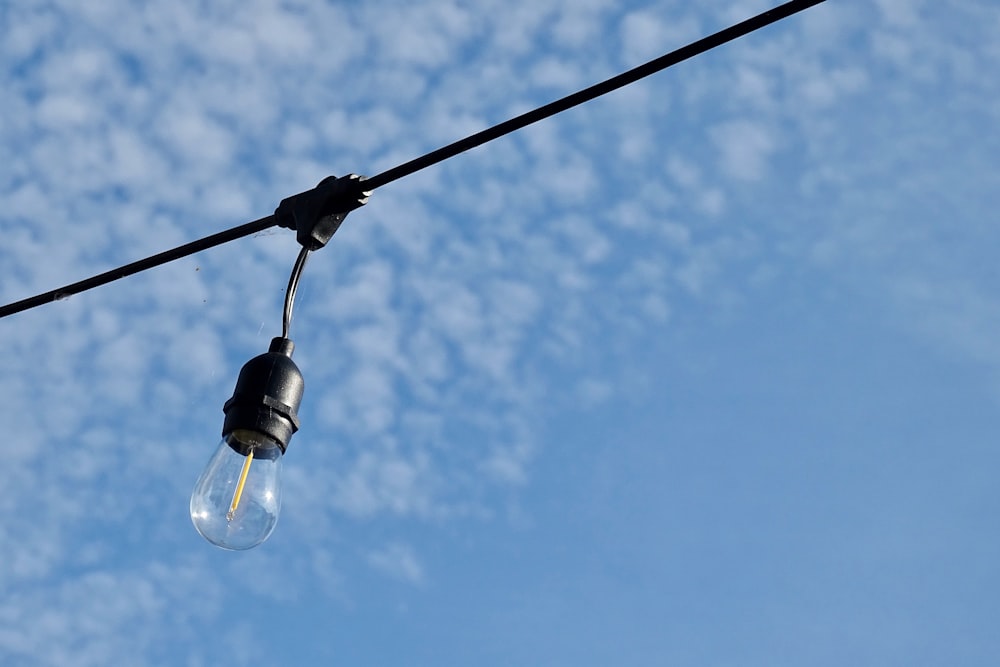 black light bulb under blue sky during daytime