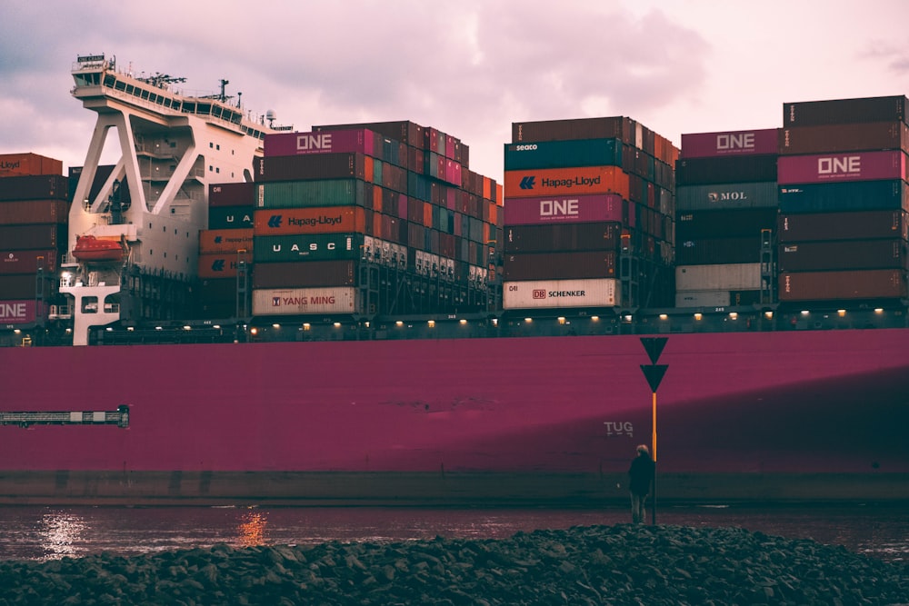 red and white cargo ship on sea during daytime