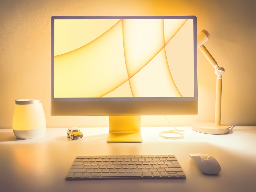 a computer monitor sitting on top of a desk