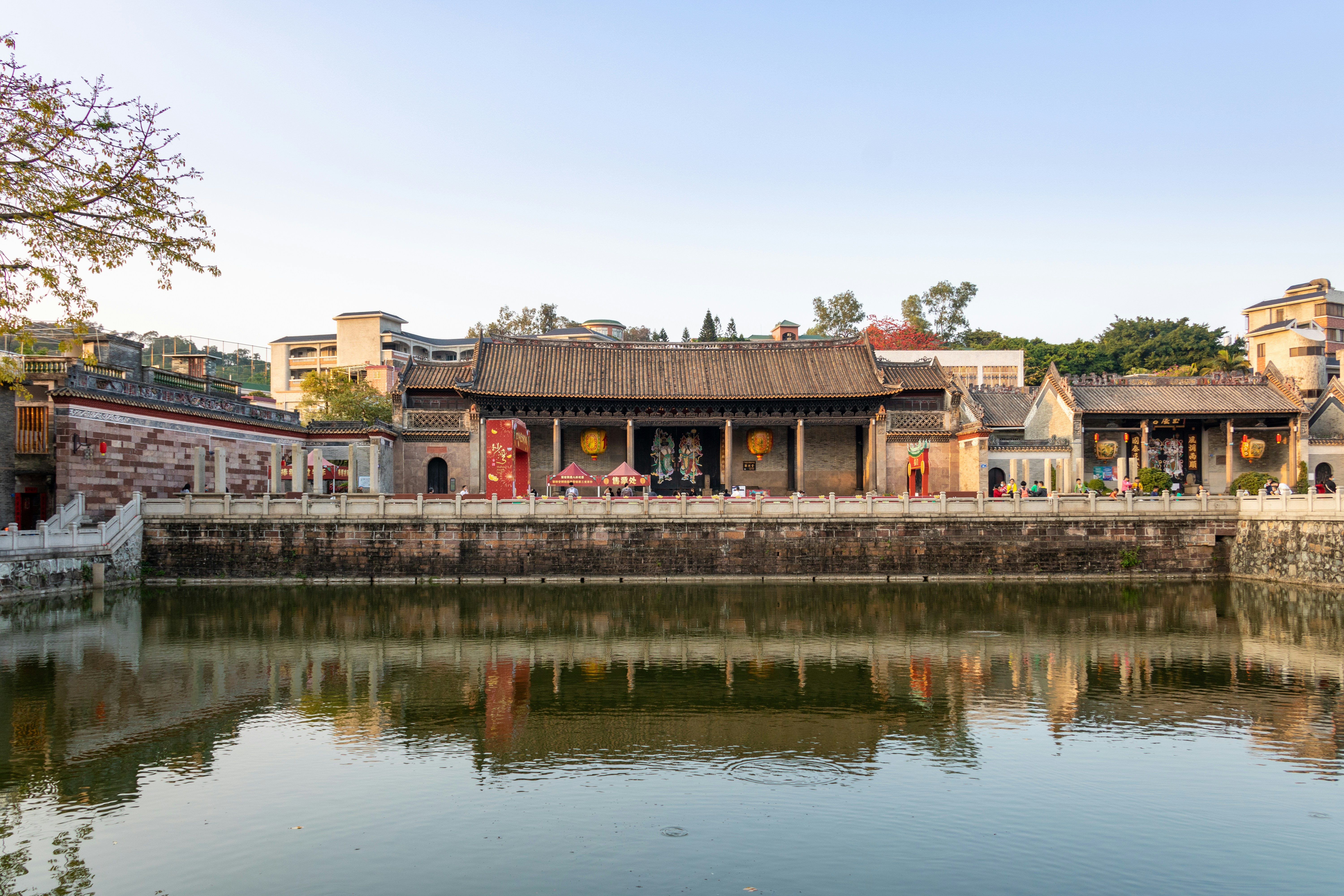 a body of water with buildings in the background