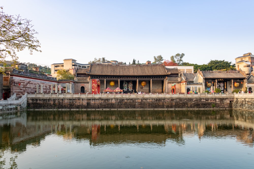 a body of water with buildings in the background