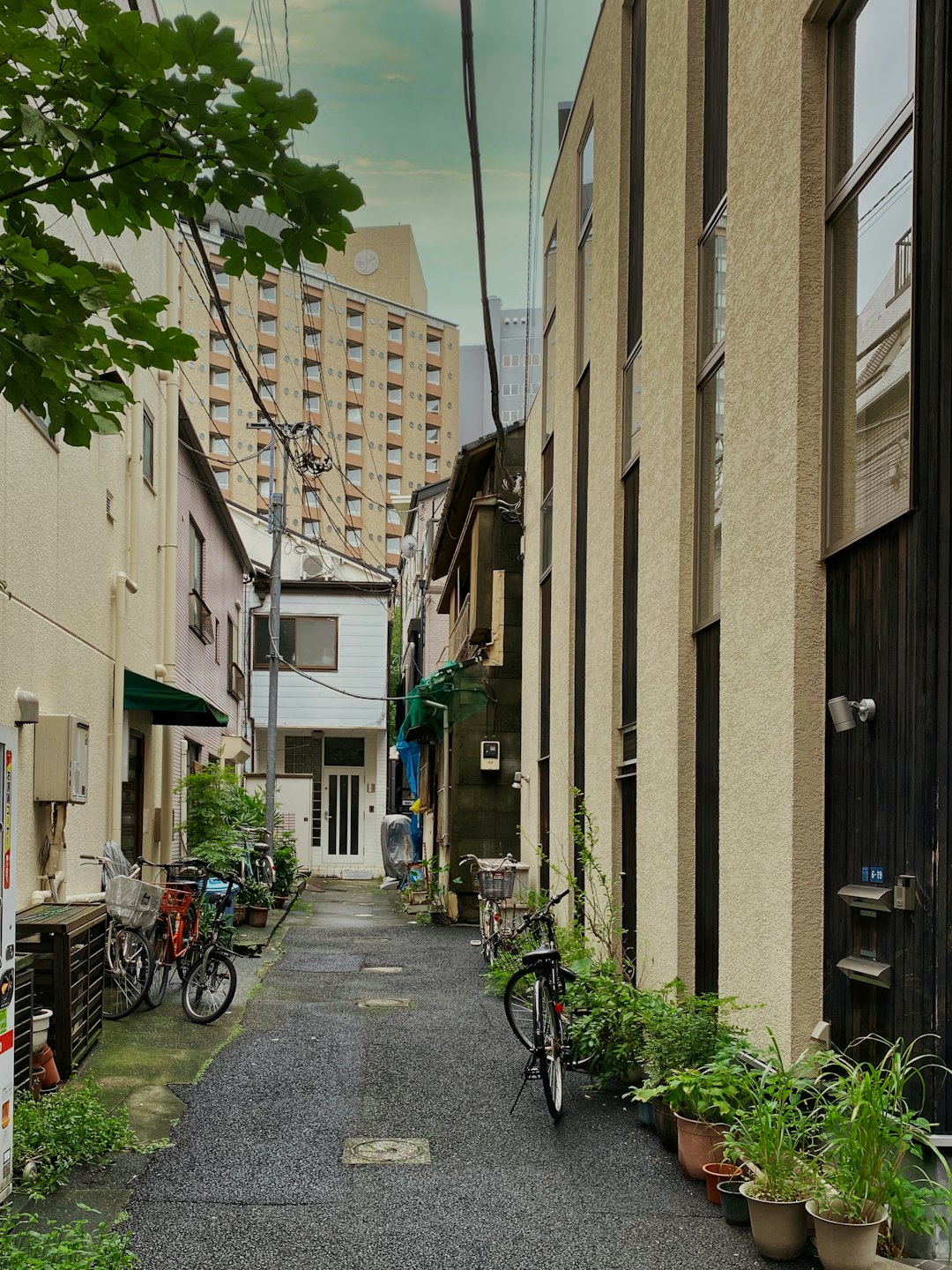 bicycles parked beside brown concrete building during daytime