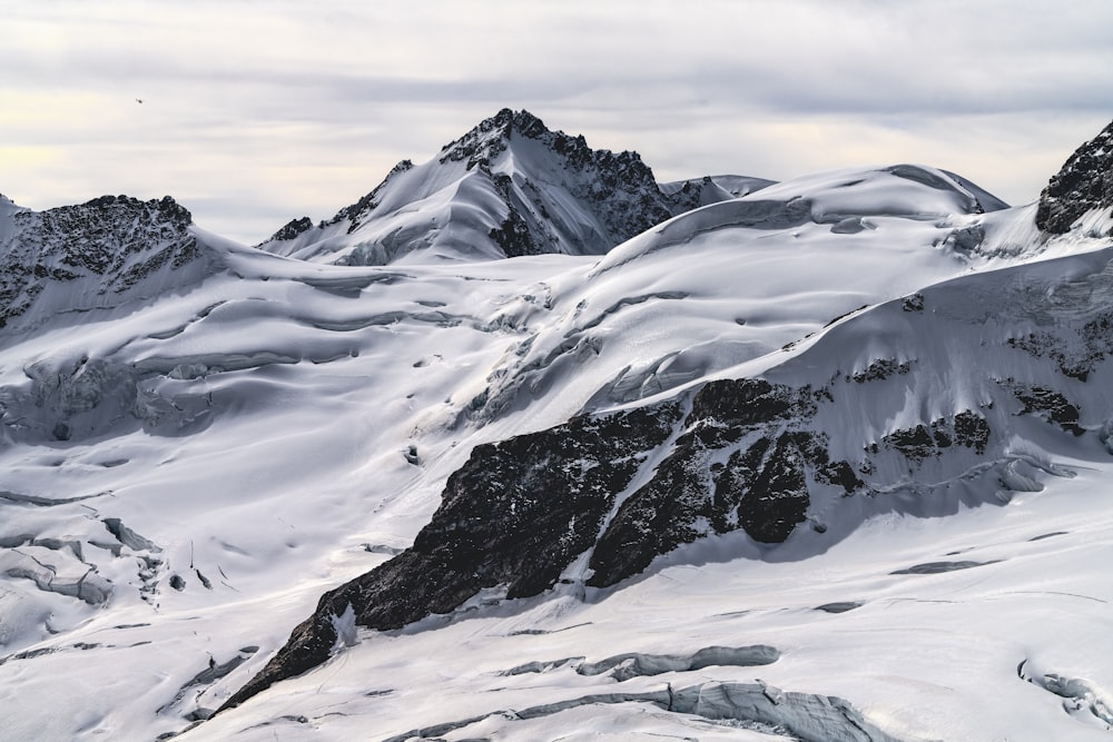 snow covered mountain during daytime