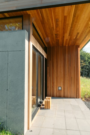 brown wooden bench near brown wooden door