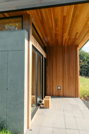 brown wooden bench near brown wooden door