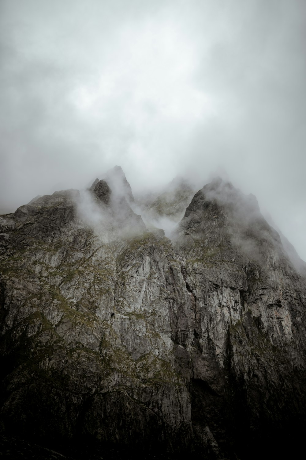 gray and green mountain under white clouds