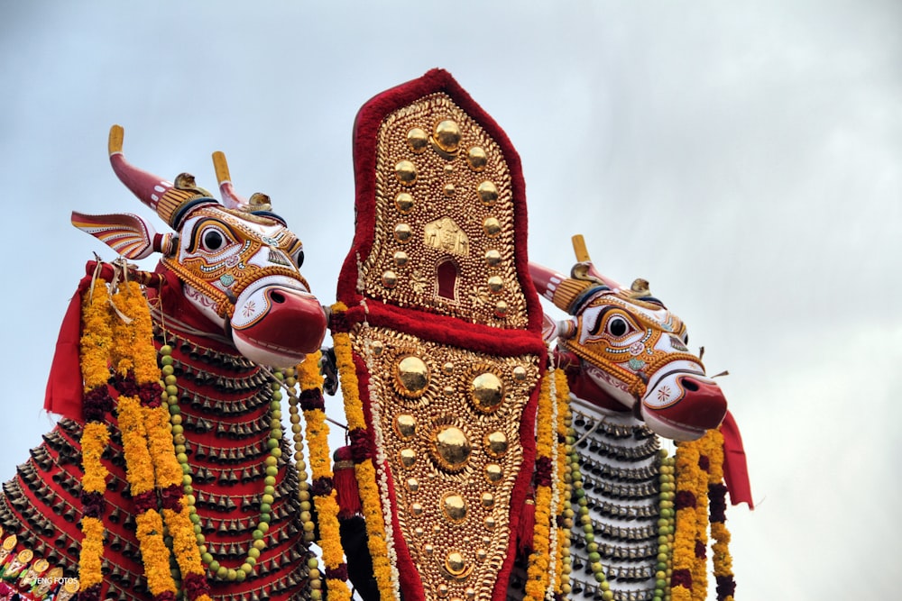 a close up of a statue of a bull and a demon