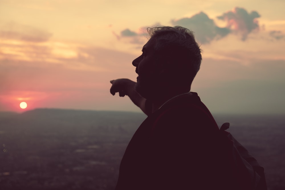 silhouette of man and woman during sunset