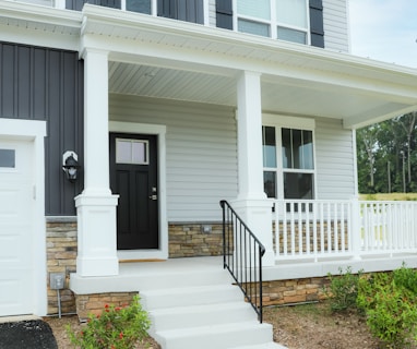 a white house with a black front door