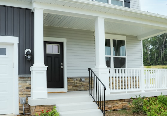 a white house with a black front door