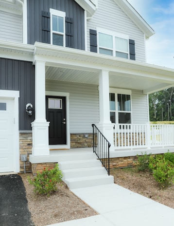 a white house with a black front door