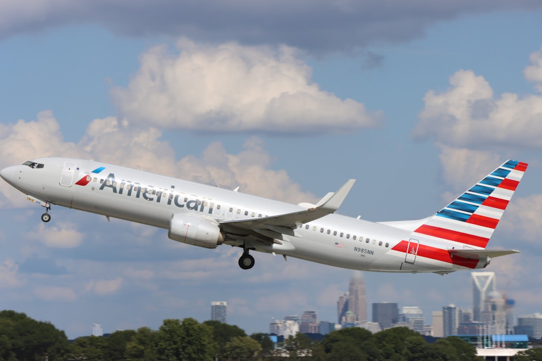 an american airlines jet taking off from an airport,