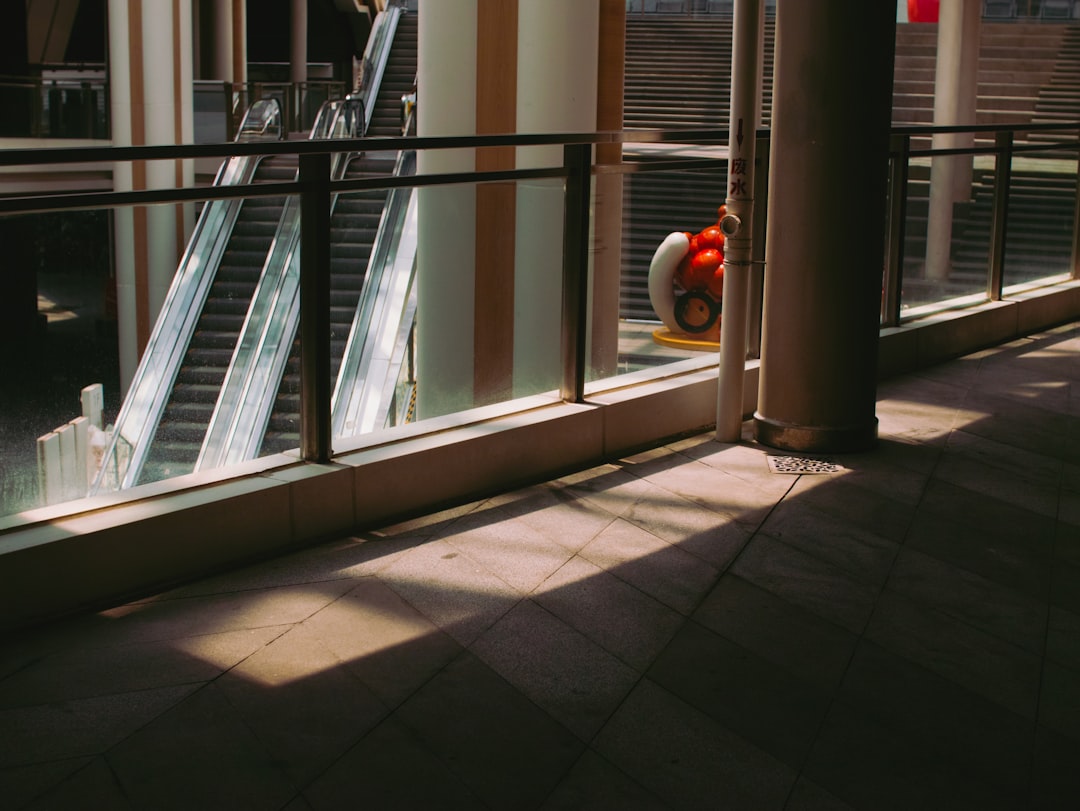 white and red round plastic container on white floor tiles