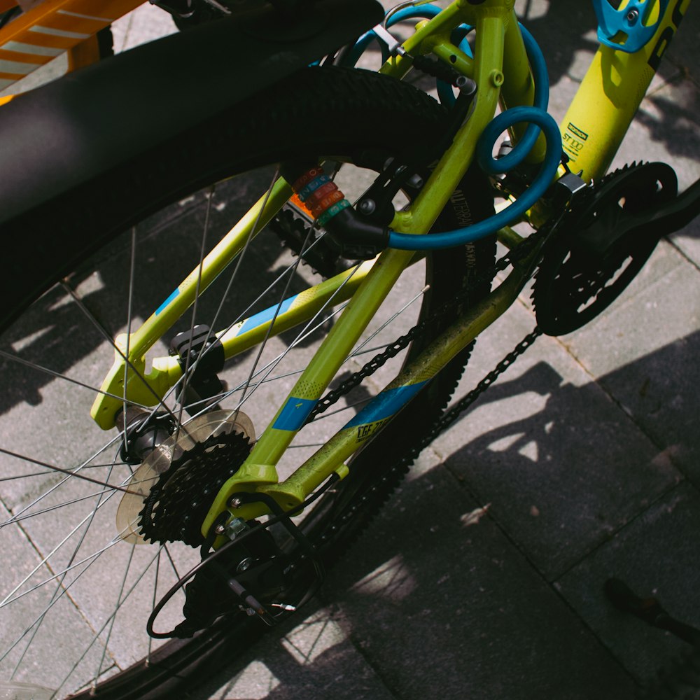 green and black bicycle on gray concrete floor