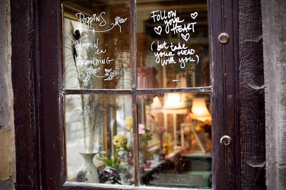 a store window with writing on the glass