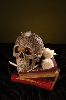 white and brown skull ceramic figurine