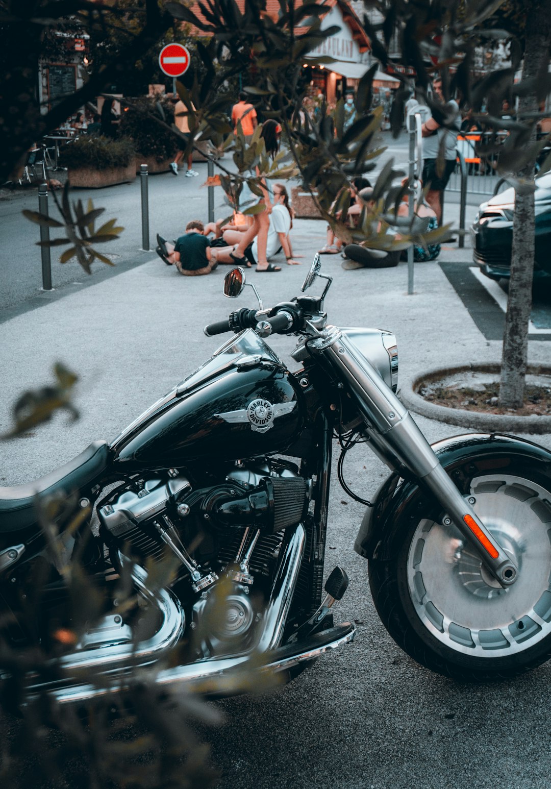 black and silver cruiser motorcycle on gray asphalt road during daytime