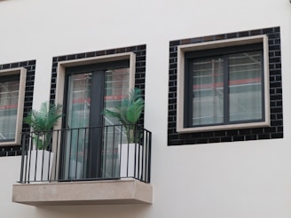 Finished metal railing with a sleek black coating on a balcony