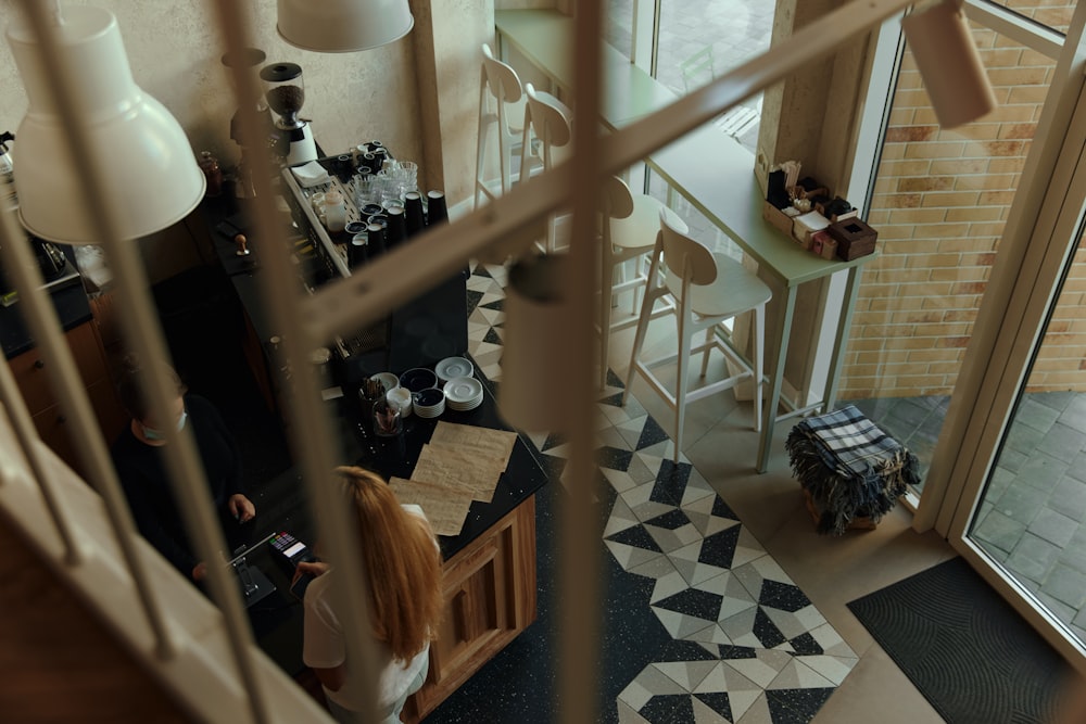 a woman sitting at a table in a room