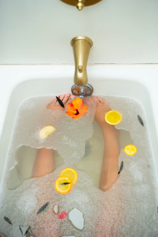 Close-up of bubbling jacuzzi water surrounded by elegant black and gold accents.