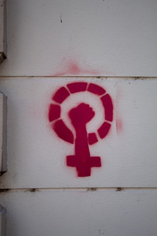 a red question mark on a white wall