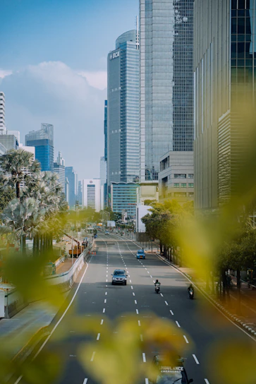 a view of a city street with tall buildings