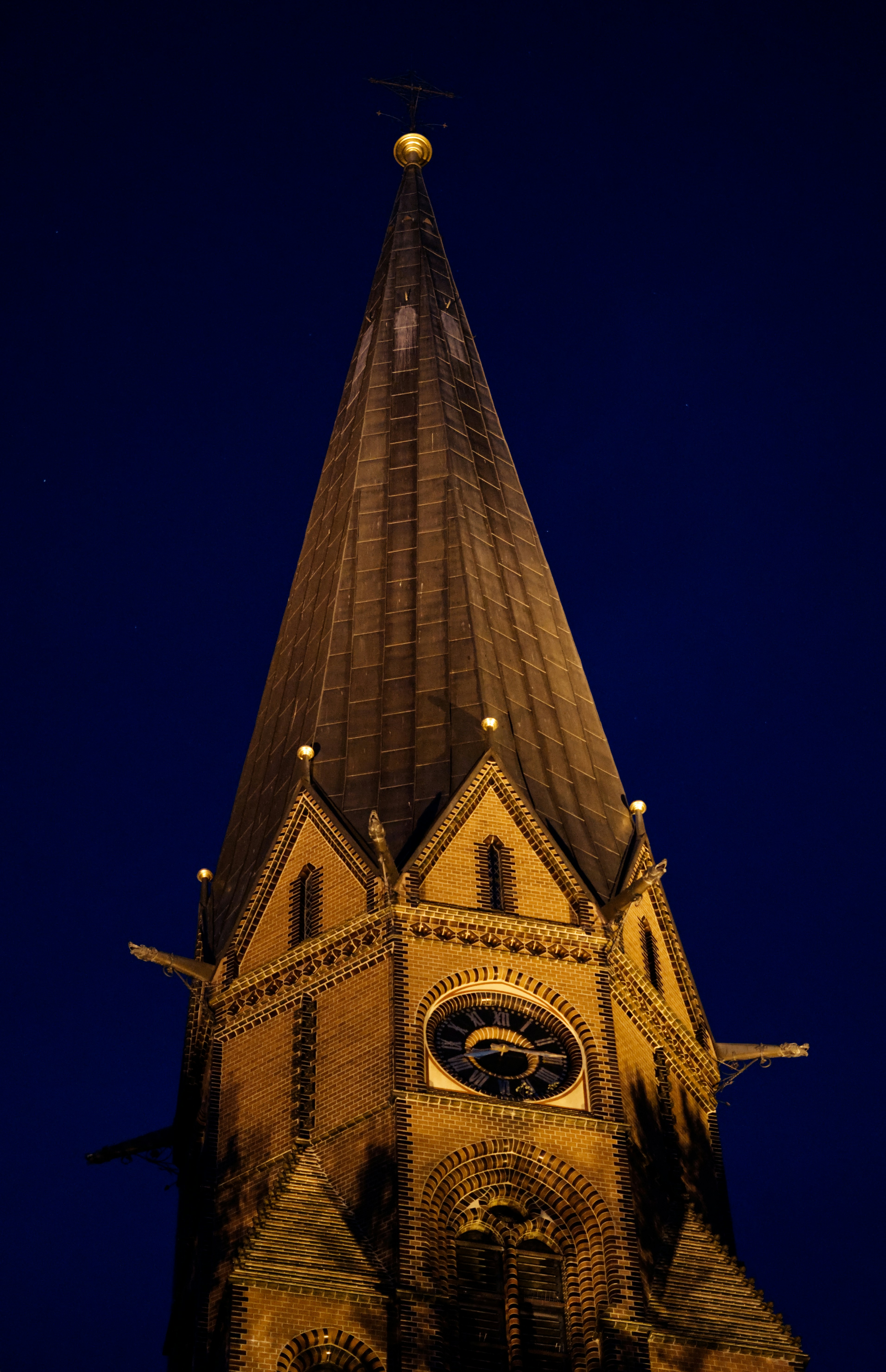 a tall clock tower lit up at night