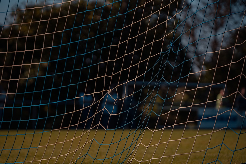 black metal fence near green grass field during daytime