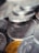 A close-up view of a pile of coins, primarily metallic in appearance with distinct engravings and details visible on the surface.