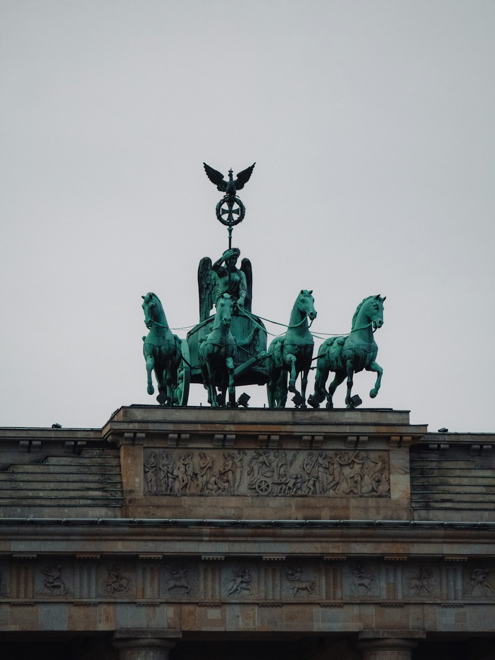 black horse statue under white sky during daytime