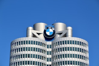 a tall building with a bmw logo on top of it