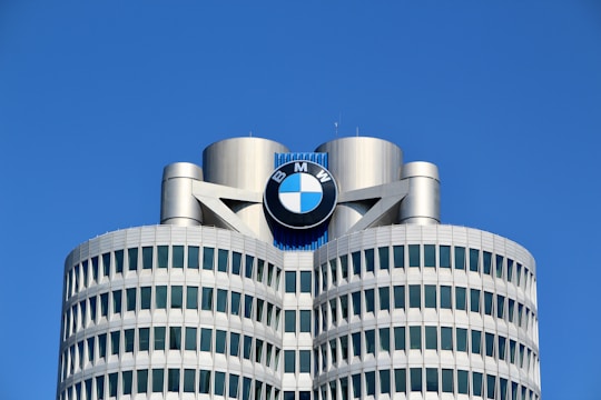 a tall building with a bmw logo on top of it