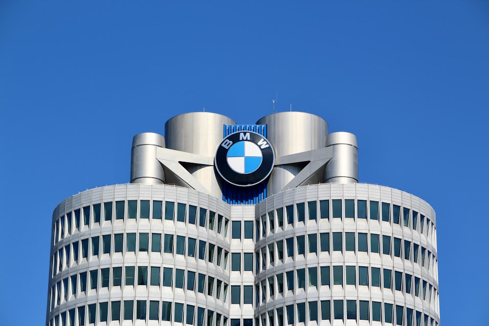 a tall building with a bmw logo on top of it