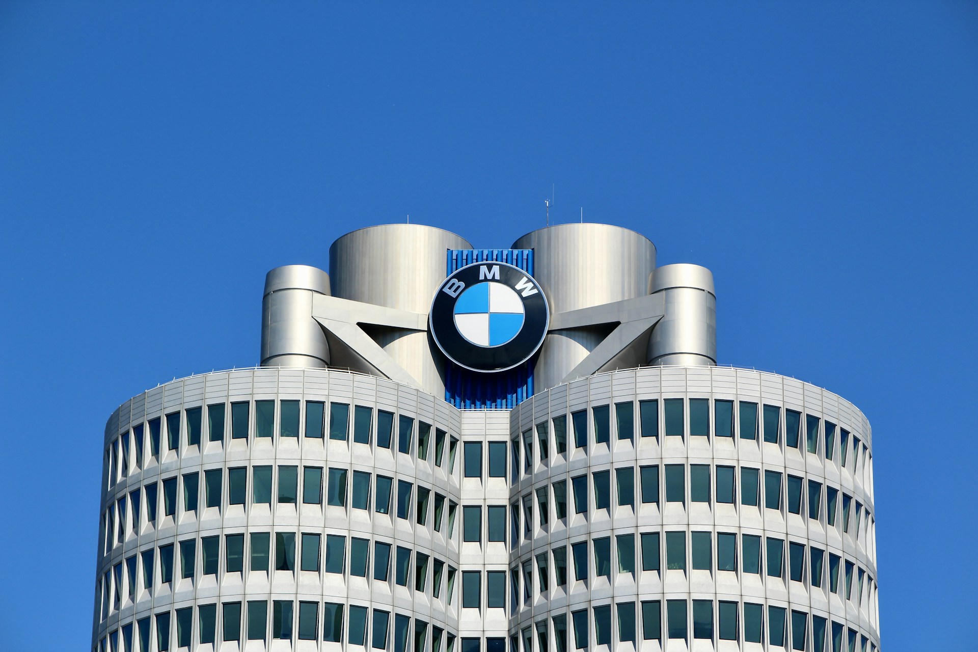 a tall building with a bmw logo on top of it