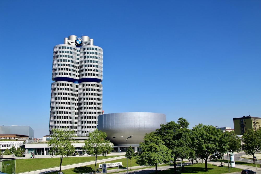 a tall building with a circular entrance in front of it