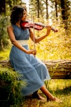 woman in white dress playing violin