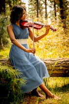 woman in white dress playing violin