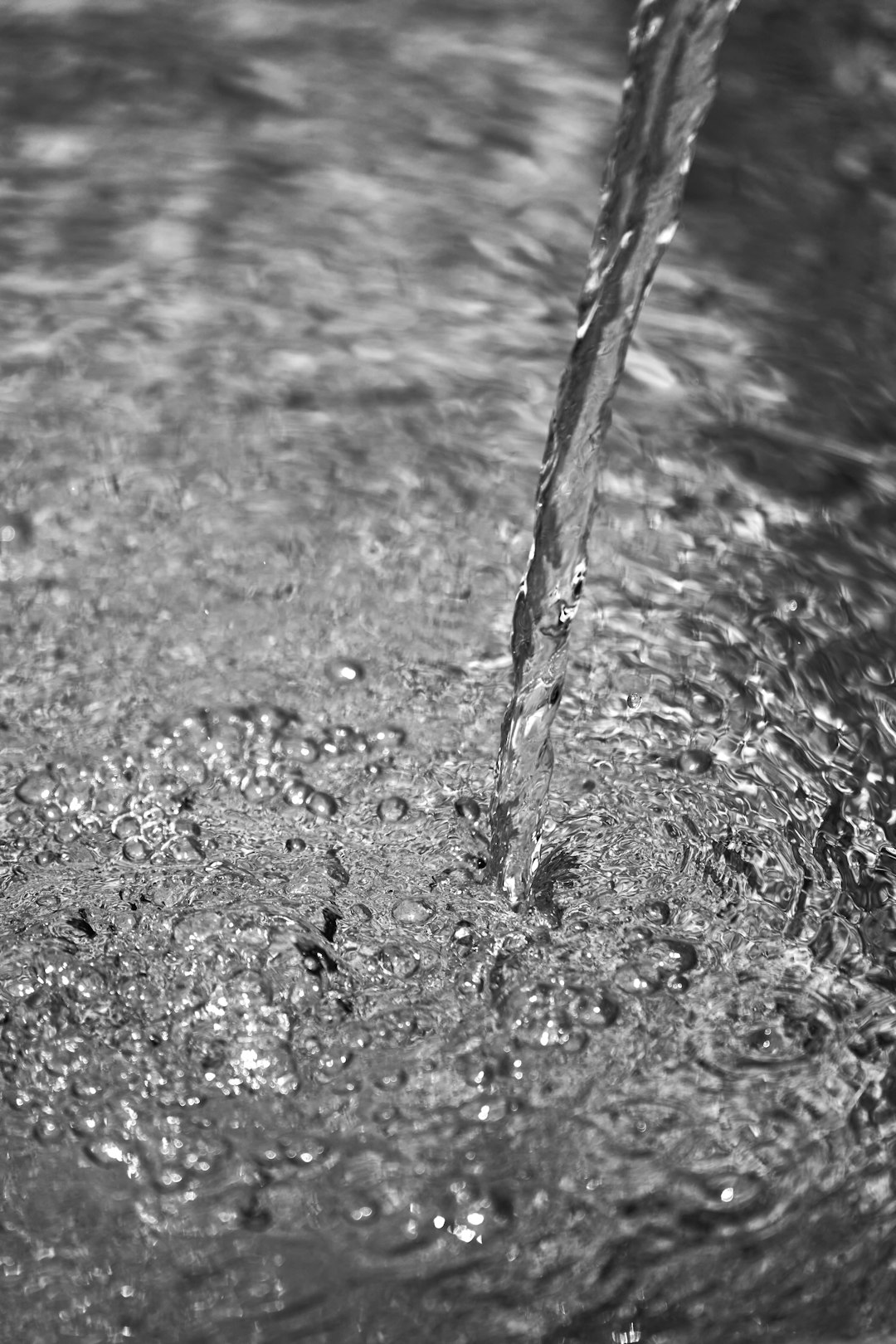 water splash in grayscale photography
