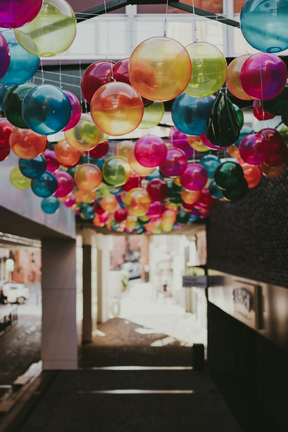 multi colored balloons on black marble table