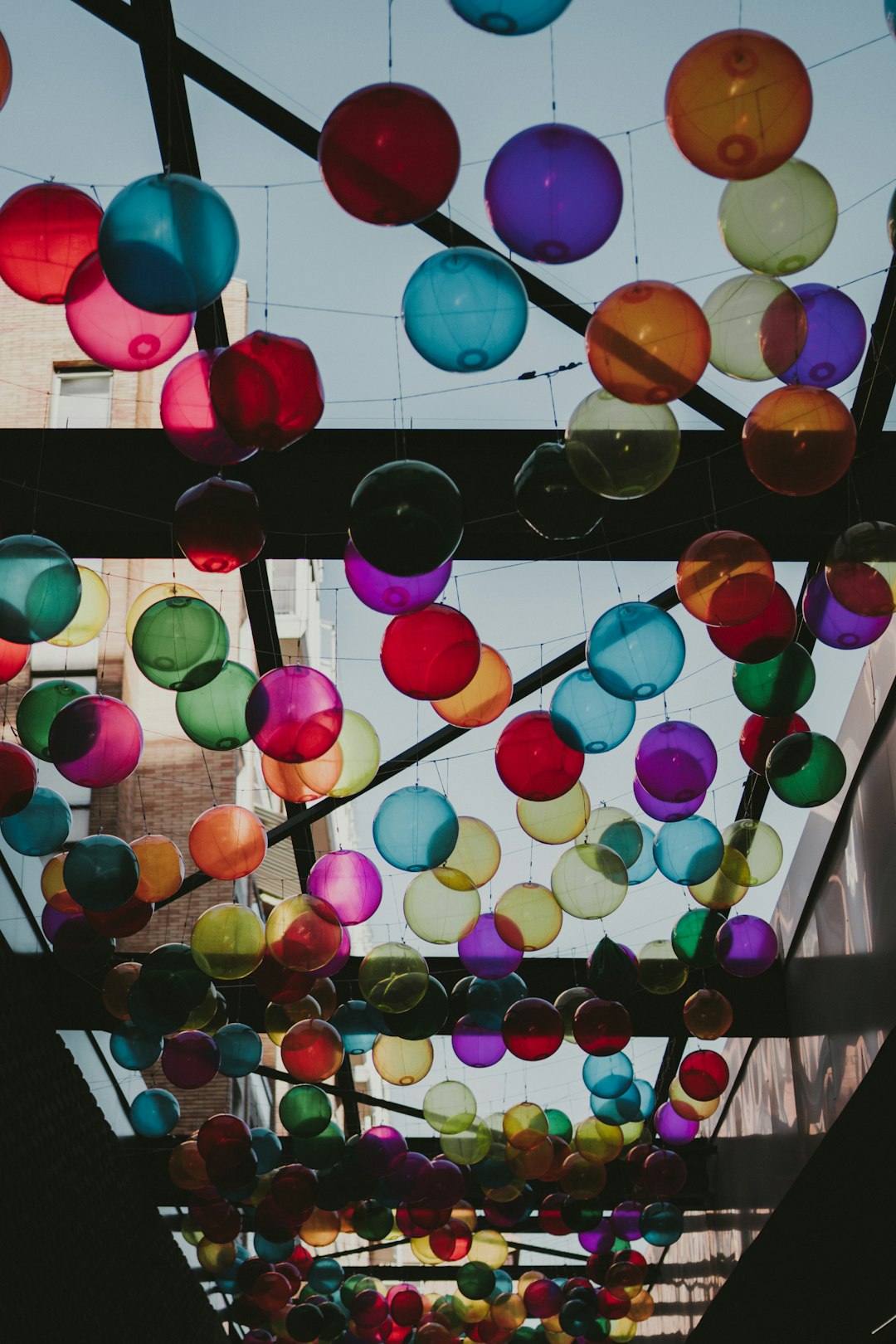 multi colored balloons on wall
