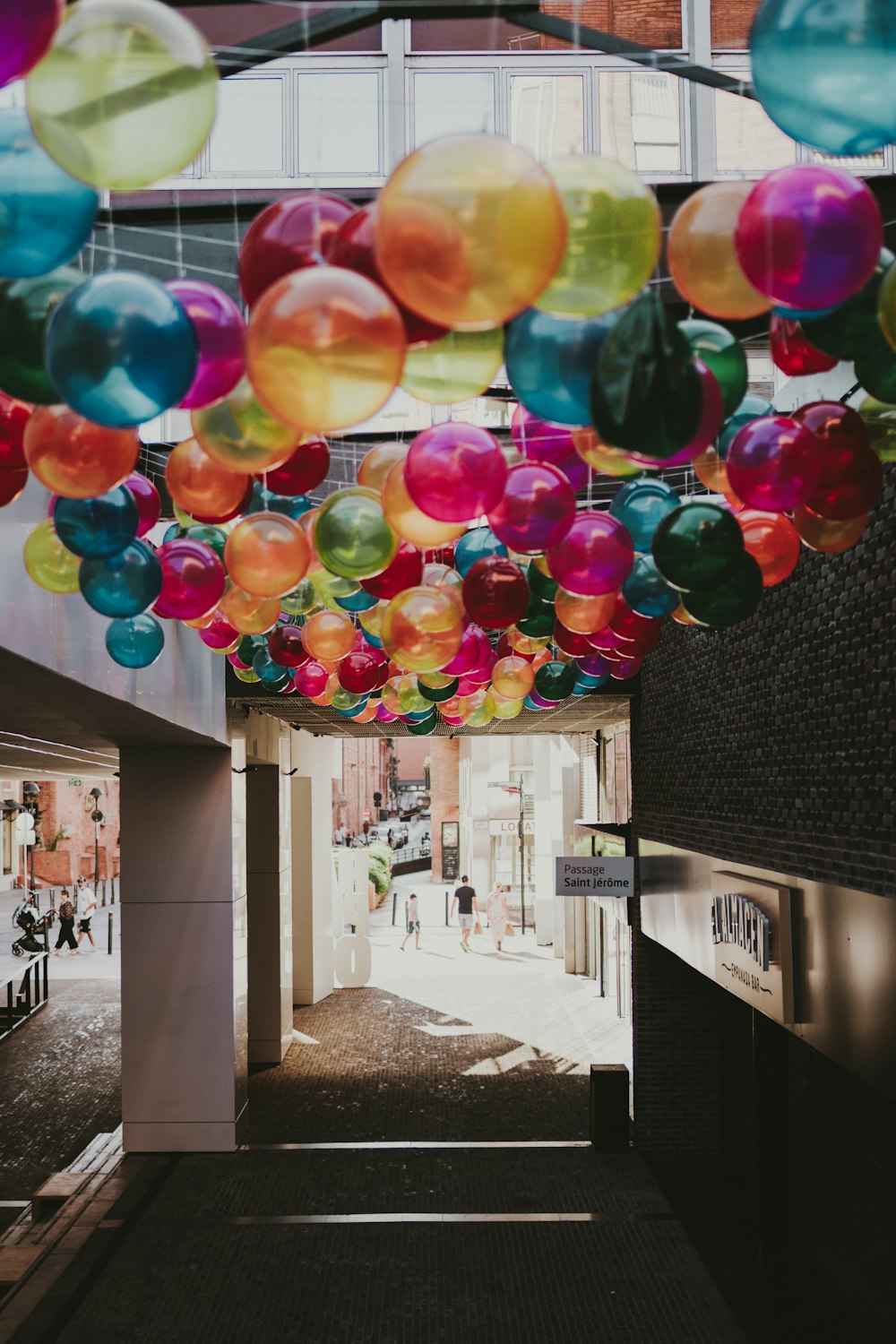 multi colored balloons on black textile