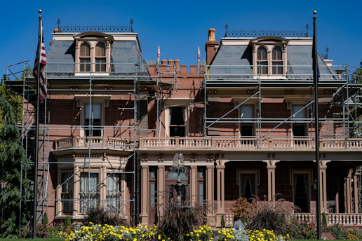 An elegant historic home mid-restoration, showcasing careful craftsmanship.