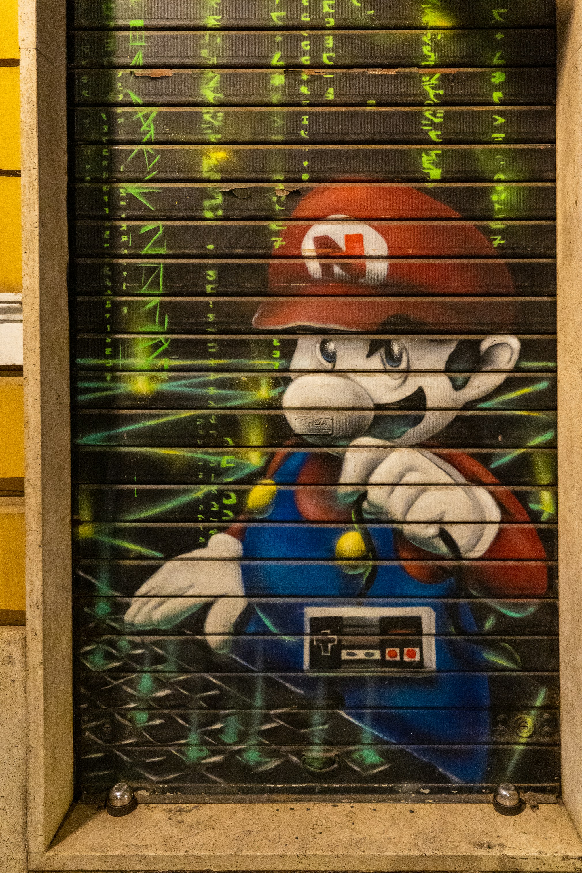 Mario, one of the characters from Super Mario, painted on a shop door shutter.