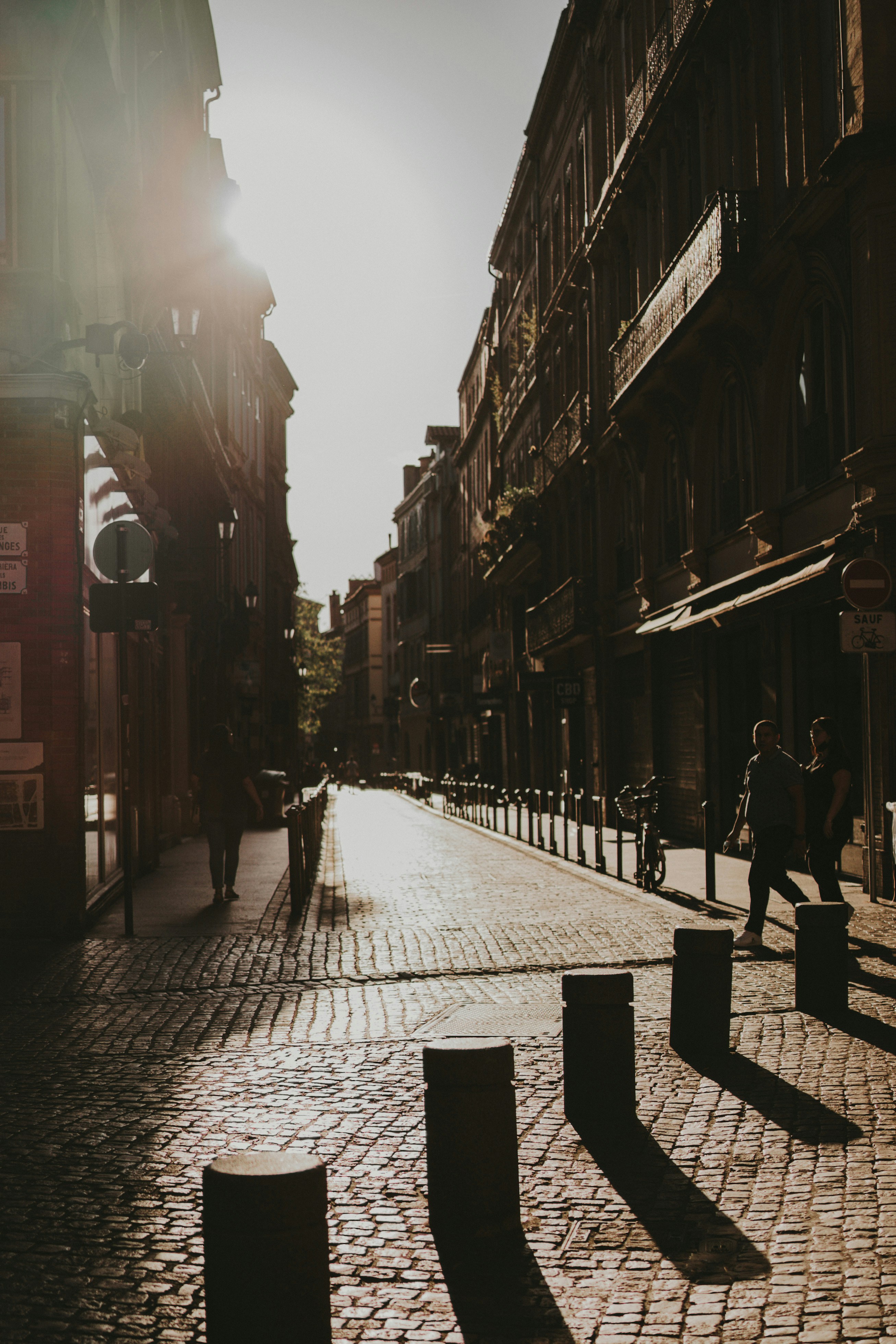 People Walking On Street Between Buildings During Daytime Photo Free Toulouse Image On Unsplash