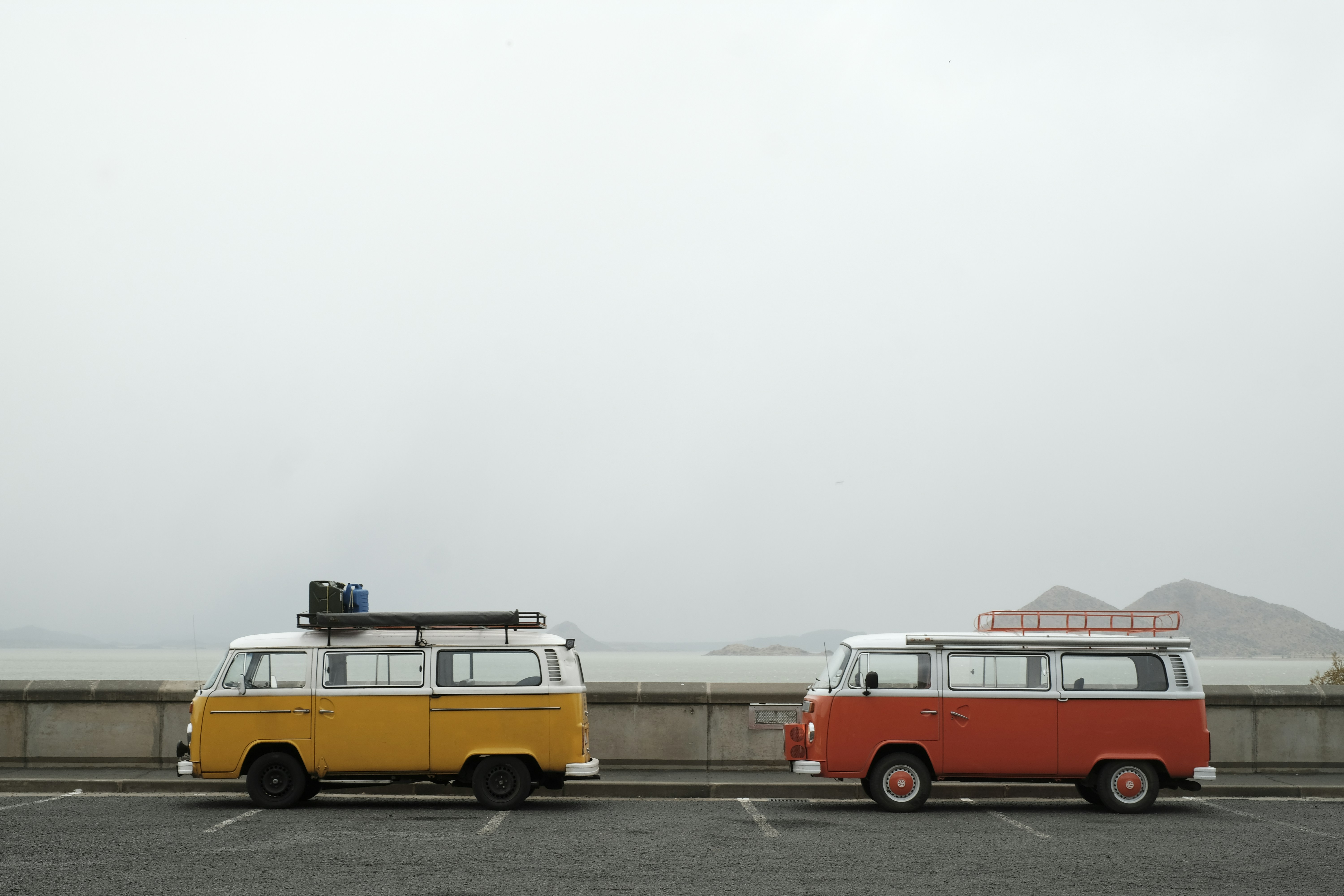 a fleet of commercially wrapped vans lined up - Car Wraps Davie