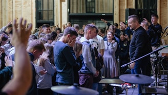 a group of people standing in front of a microphone