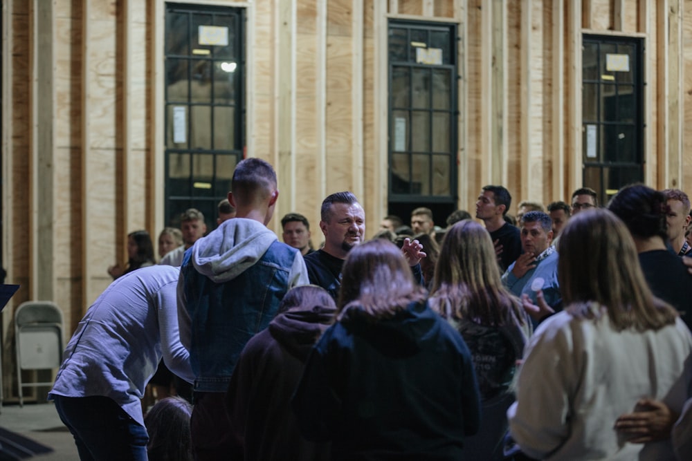 a group of people standing in front of a building