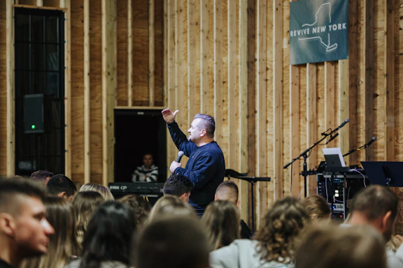 a man standing in front of a crowd of people
