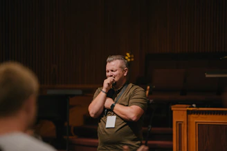 a man standing in front of a microphone
