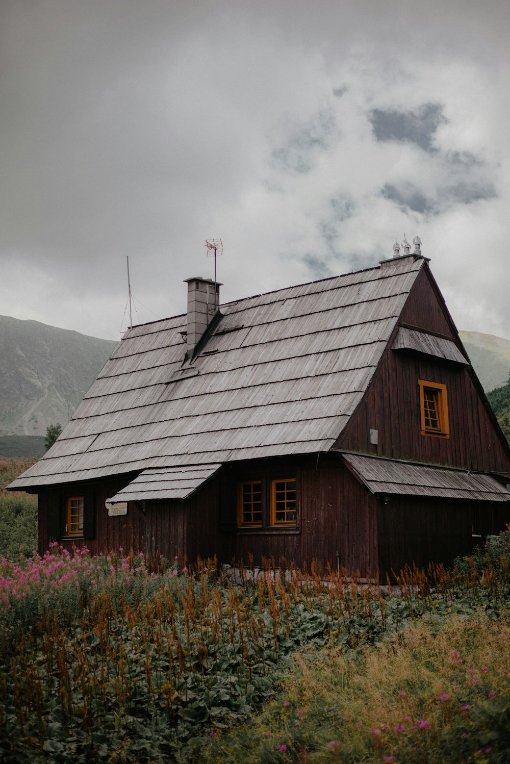 a small wooden house with a metal roof